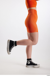 Unaisa  1 black sneakers dressed flexing leg orange bike…